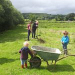 The team planting a willow dome